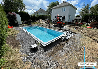 Inground pool Installation by Patio Design inc.