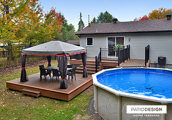 Patio with overground pool by Patio Design inc.