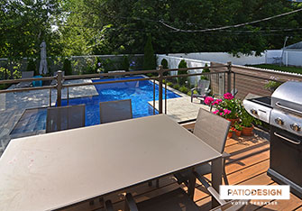 Patio with inground pool by Patio Design inc.